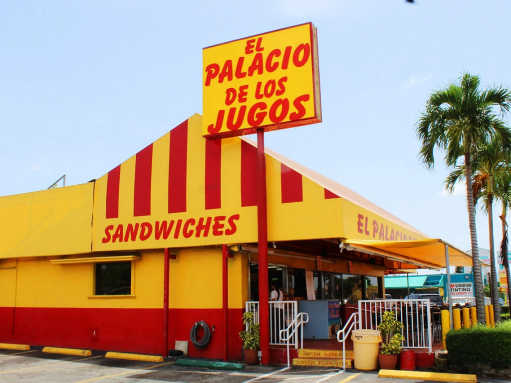 El Palacio De Los Jugos pylon sign at Bird Road. Lateral view with its signature red and yellow awnings.