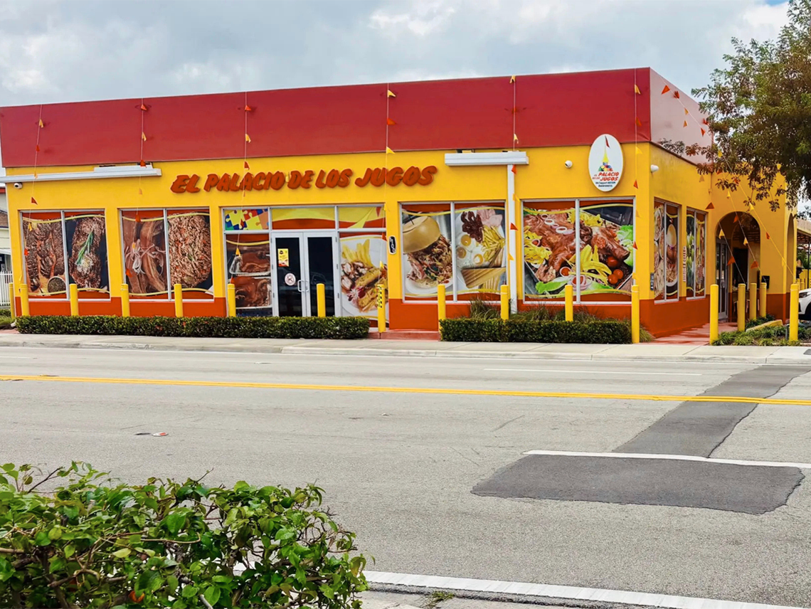 El Palacio de los Jugos at Hialeah East out front: red roof, yellow walls, and windows featuring traditional Cuban food.