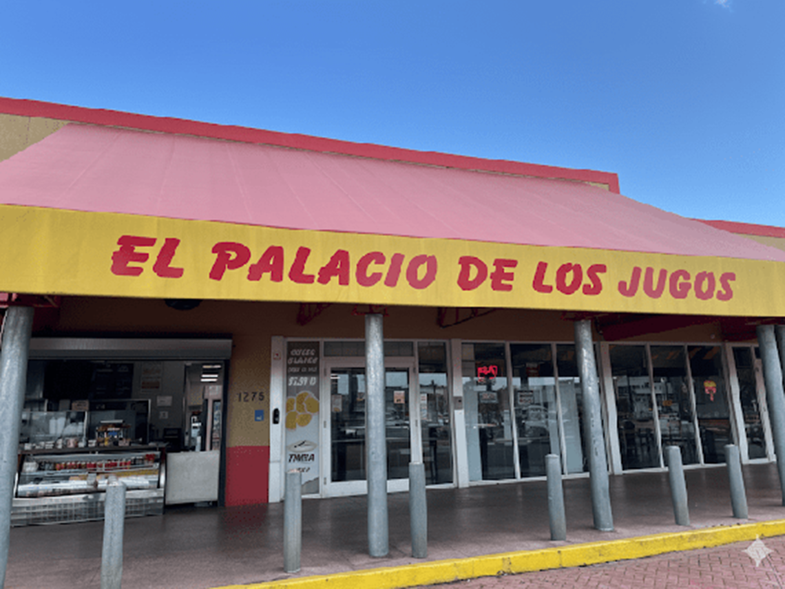 El Palacio de los Jugos at Hialeah. Red roof, yellow marquee, red lettering, large windows, and an outdoor display case with fresh products.
