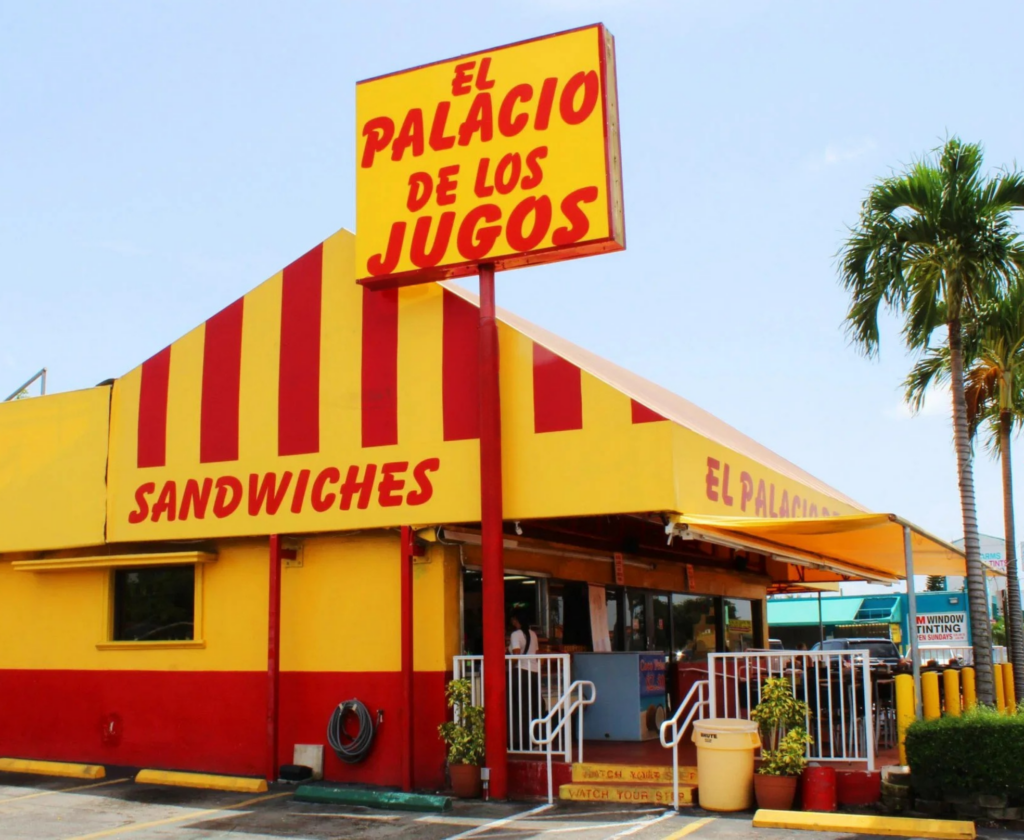 El Palacio De Los Jugos pylon sign at Bird Road. Lateral view with its signature red and yellow awnings.